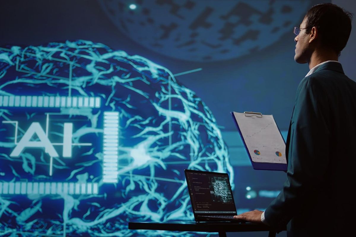 A man in a suit stands before a computer screen displaying an AI logo, representing AI Data Integration.